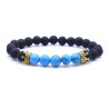 PULSERA PIEDRA LAVA HOWLITA AZUL CORONA DORADA